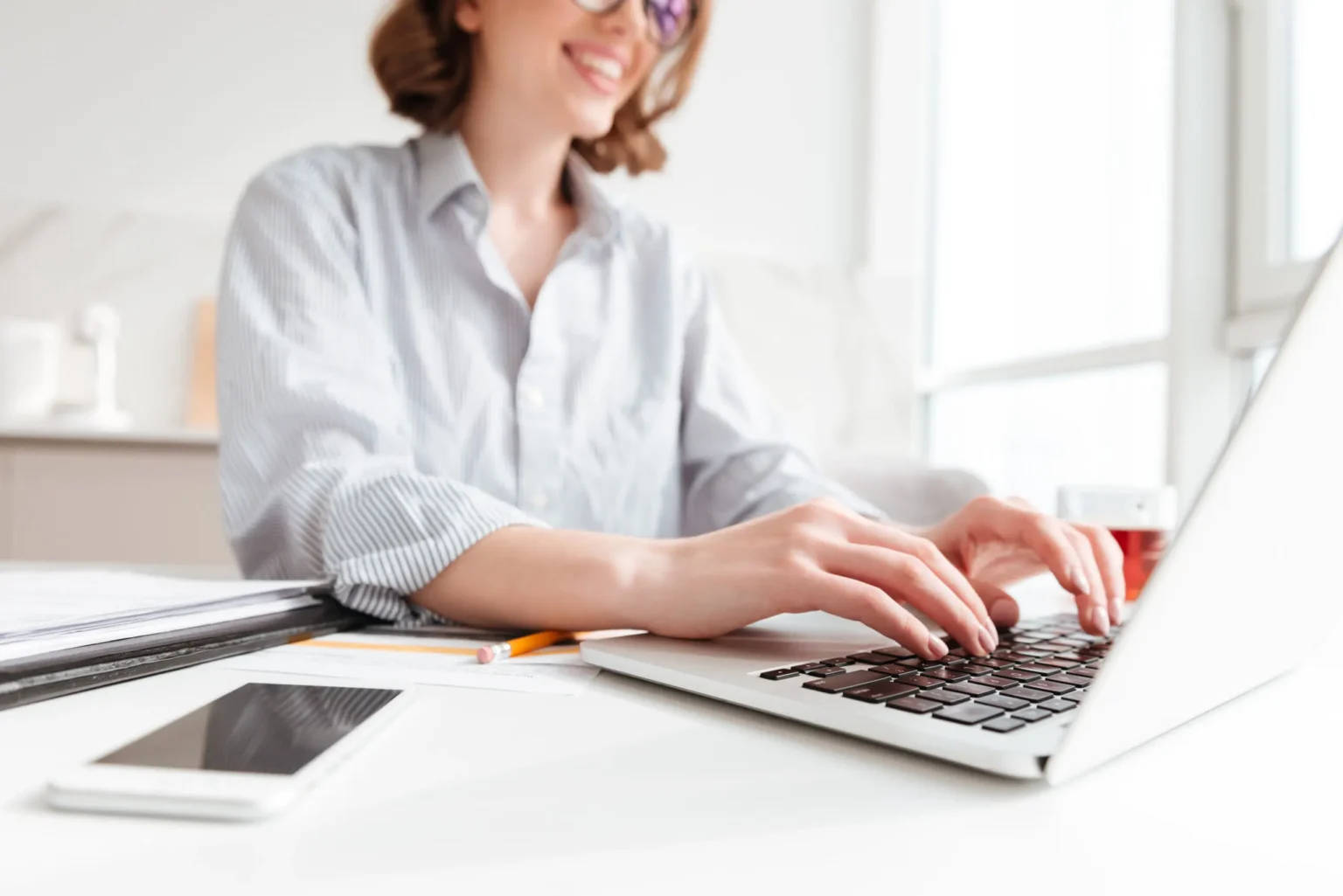 brunette woman typing email laptop computer while sitting home selective focus hand scaled
