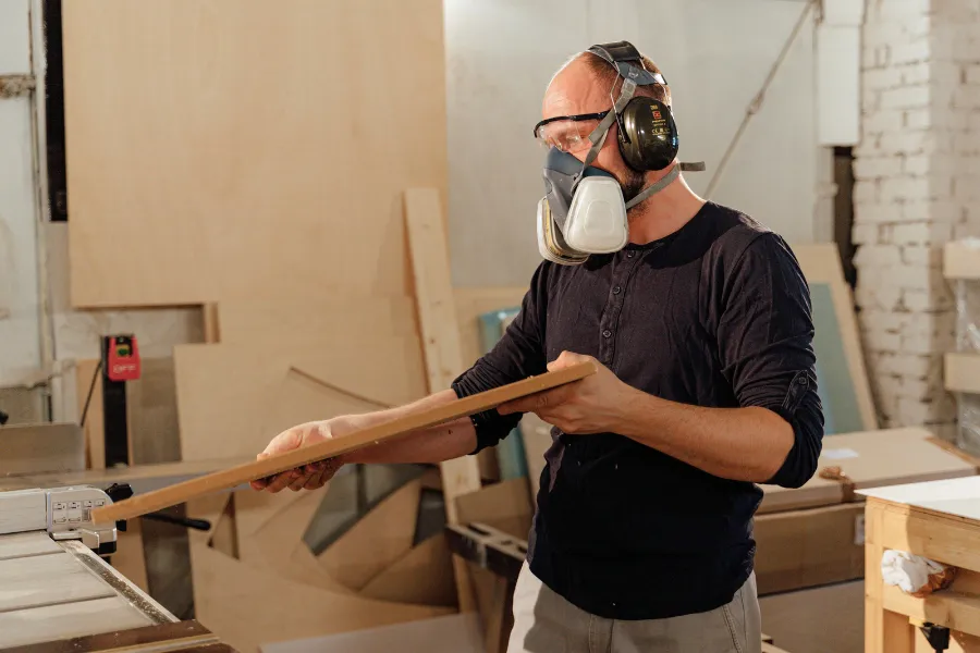 Man wearing a specialized mask while doing construction work